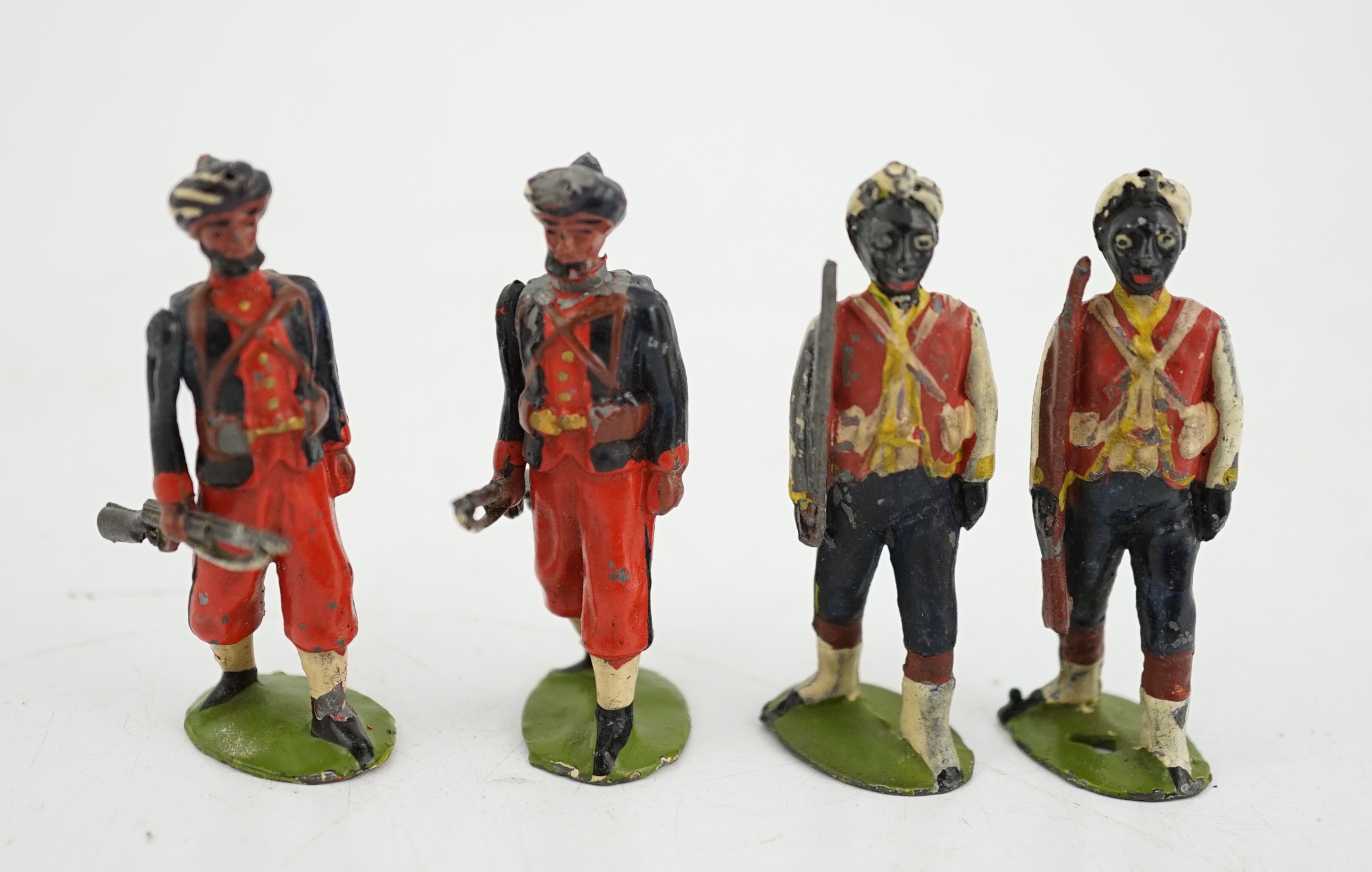 Twenty-five early twentieth century Britains lead soldiers including; eight Bombay infantry (possibly from set 68) and seventeen West Indian Regiment infantry